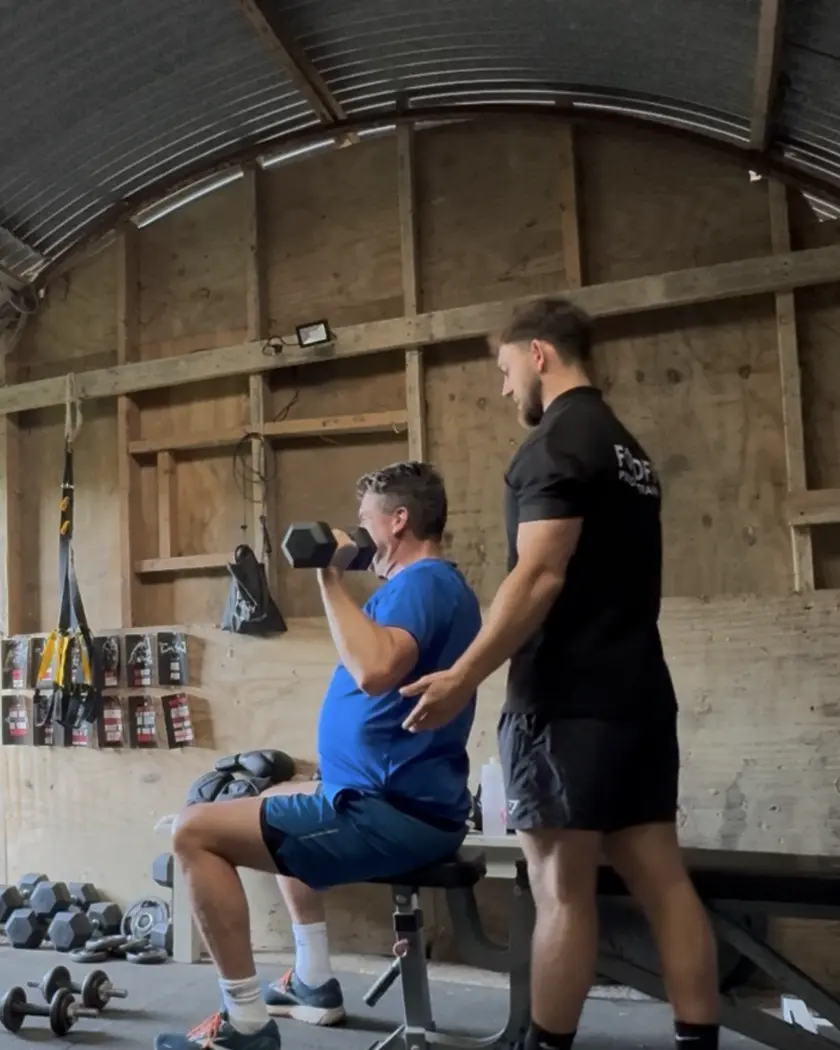 Personal training session in a home garage gym